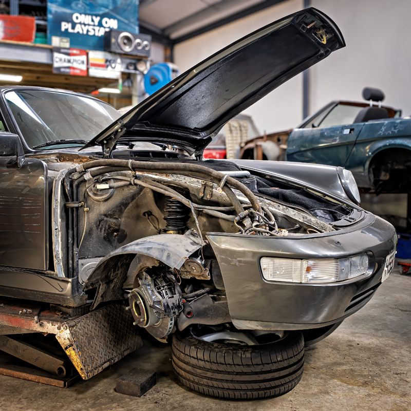 Images showing classic car under restoration by Austin Motor Services Ltd, Cove, Farnborough, Hants.